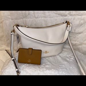 Beautiful white coach purse peanut butter interior